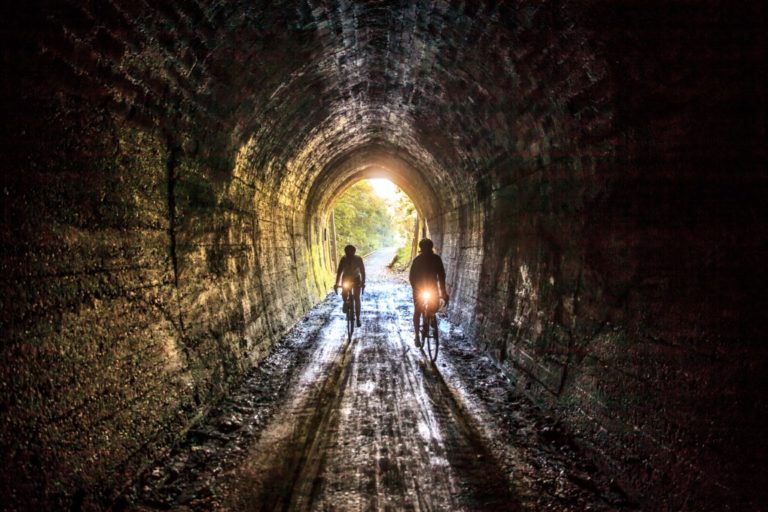 Cyclists Inside Spooners Tunnel on Tasmans Great Taste Trail credit George Guille Media Medium 768x512